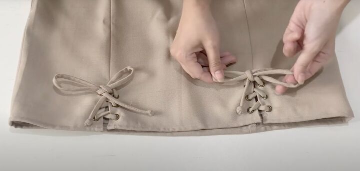 how to diy a cute lace up mini skirt, Threading laces through eyelets