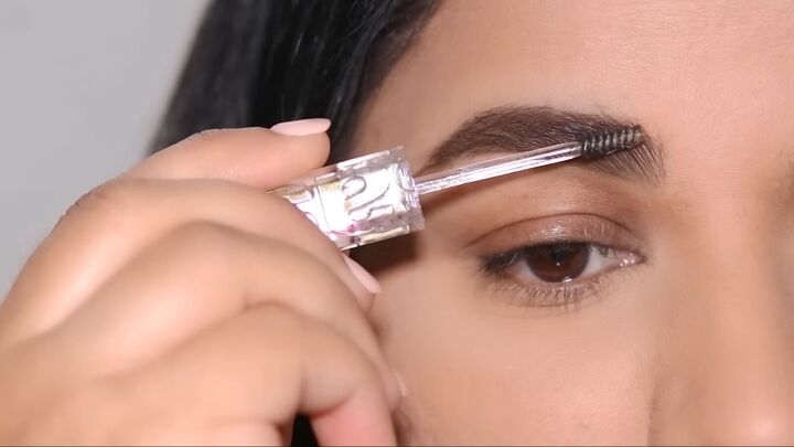 easy and glam cut crease eye makeup tutorial, Applying brow gel