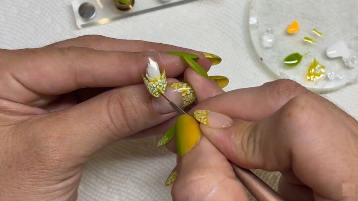 how to do an easy lime green french manicure for spring, Adding center of flowers