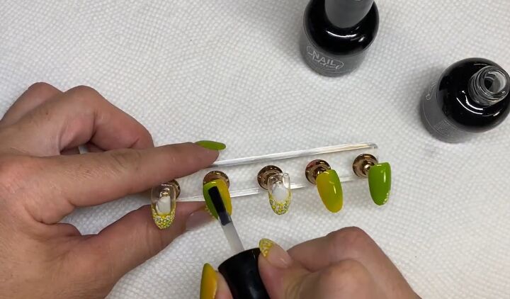 how to do an easy lime green french manicure for spring, Applying top coat