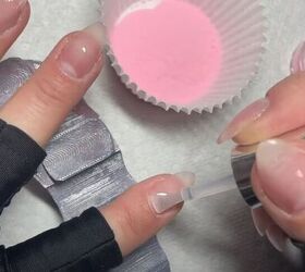how to diy glazed pink hailey bieber nails at home, Applying dip liquid