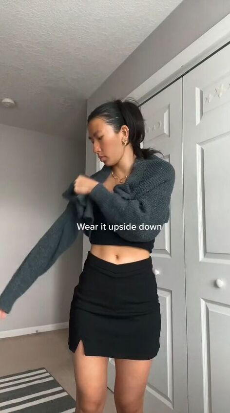 an easy hack to crop your cardigan and change its neckline, Putting cardigan on upside down
