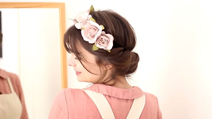 15 quick and easy cottagecore hairstyle ideas, Floral headband rolled updo