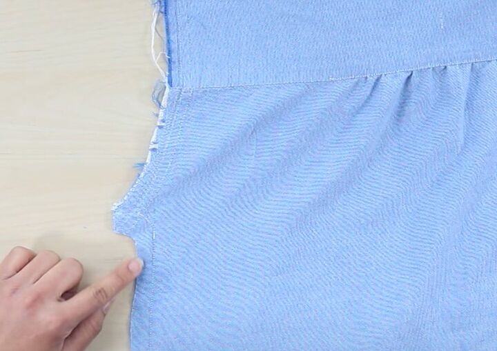 how to upcycle a men s shirt into a cute ruffle mini dress, Taking in side seams