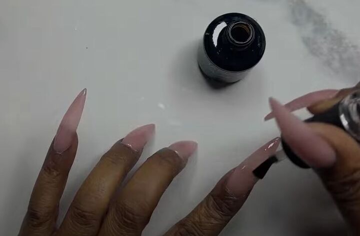 how to diy tiktok trending pink glazed donut nails, Applying base coat