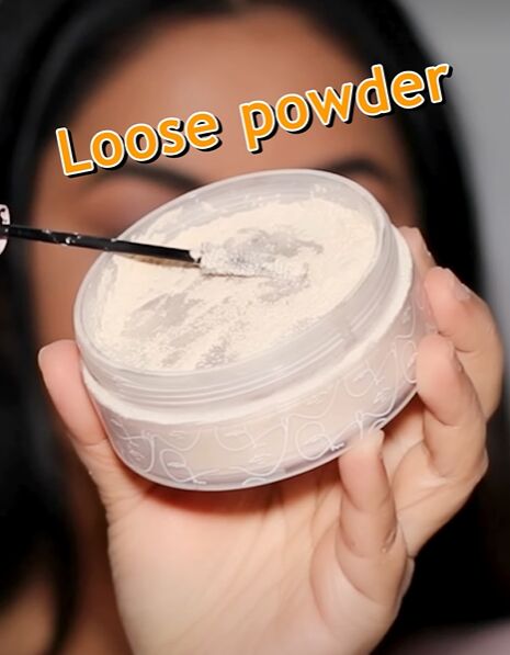 super easy mascara hack for seriously voluminous lashes, Dipping your mascara wand into loose powder