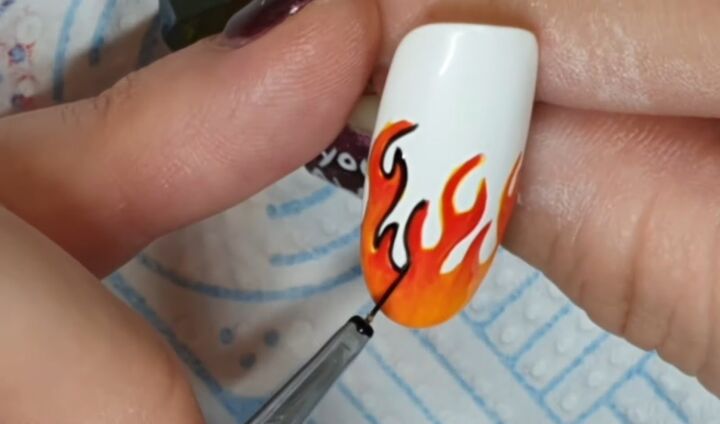 how to diy awesome orange flame nails, Outlining flames