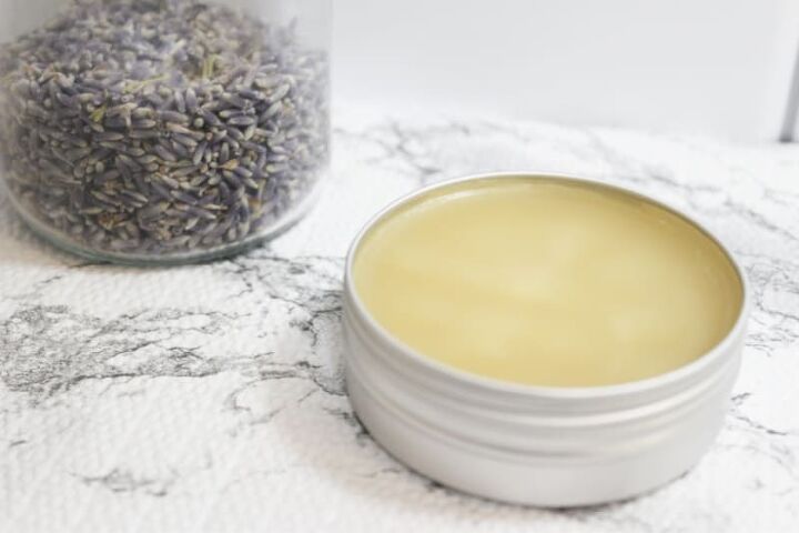 sunburn salve recipe, a jar of salve near lavender buds