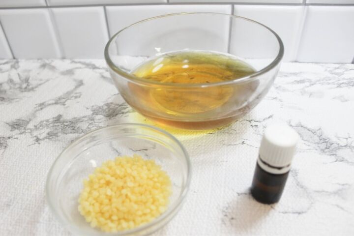 sunburn salve recipe, ingredients on a white counter
