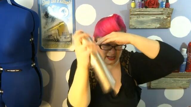 glam ballerina bun tutorial, Adding hairspray