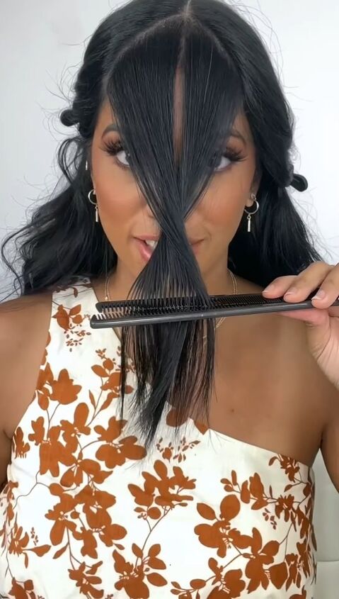 how to cut long curtain bangs the easy way, Twisting hair