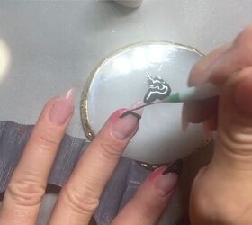 She paints a line on her nail like this for the unexpected manicure idea