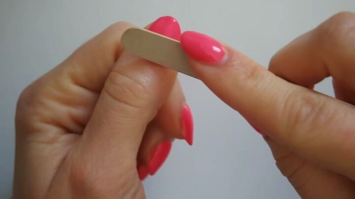how to fix gel nails that have lifted at home, Filing