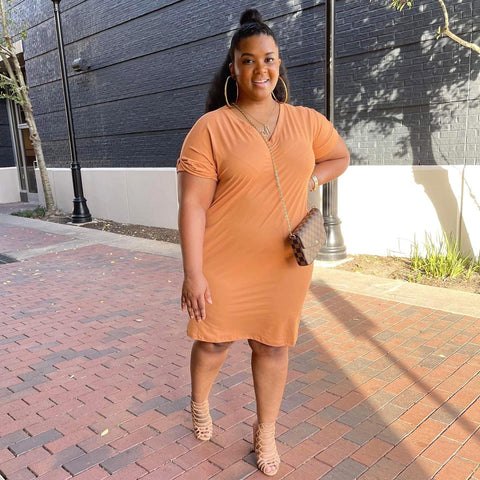 casually style this easter with minimal effort, Morgan B wearing a butterscotch orange casual dress with a faux Louis Vuitton gold chain cross body purse