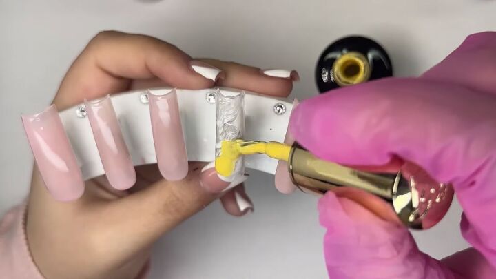 how to create cute french tip yellow nails for spring, Applying yellow gel polish