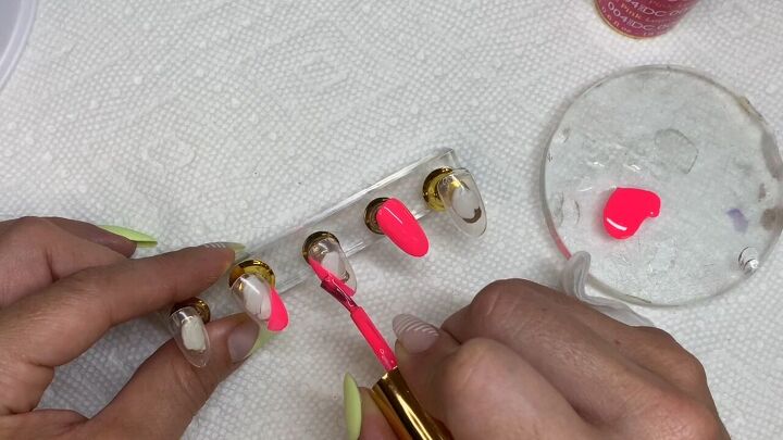 how to diy cute neon pink nails with a fun striped design, Painting nail