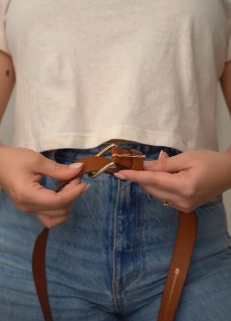 super simple hack for storing your belts, Threading end of strap through buckle frame