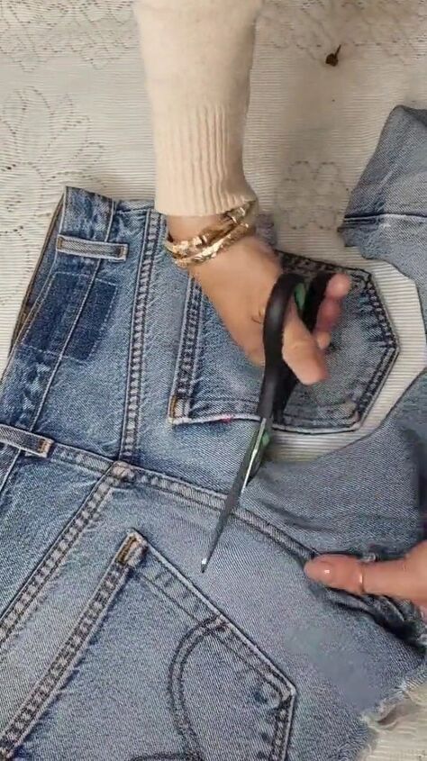 tear up some old denim for this beautiful diy accessory, Cutting the shorts