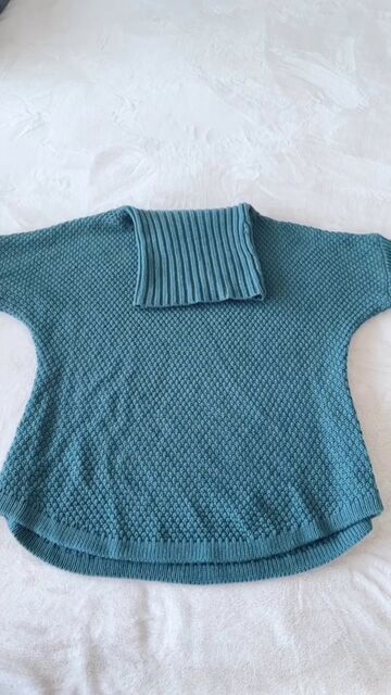 put your winter sweaters away like this to save space, Folding neck down