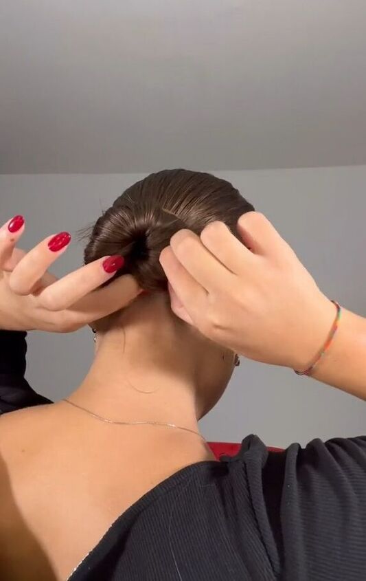 my easy hack for getting that slicked back look, Tying hair into bun