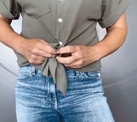 tie your shirt like this for a more polished look, Tying top