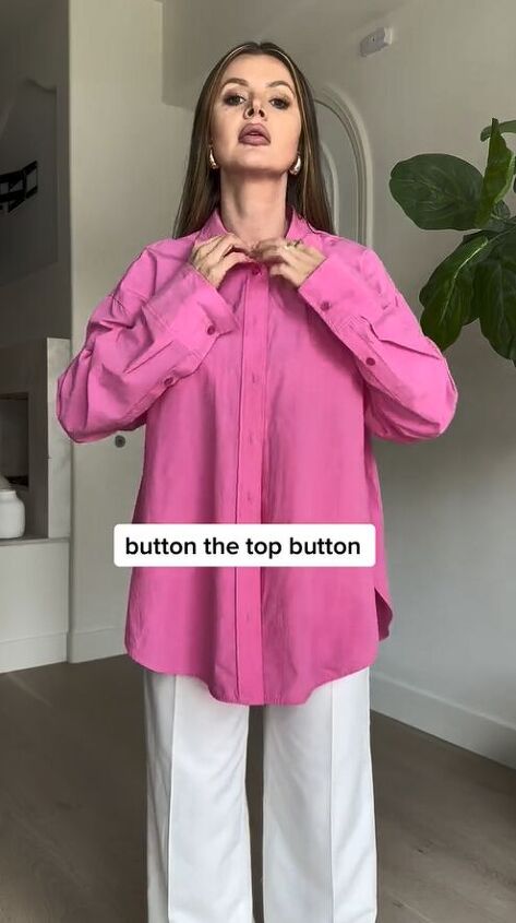 you ve never seen a button down blouse styled like this, Putting on the button down