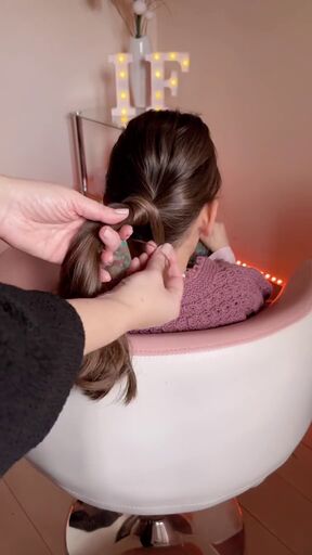 this hack gives your ponytail an elevated look, Hiding hair tie