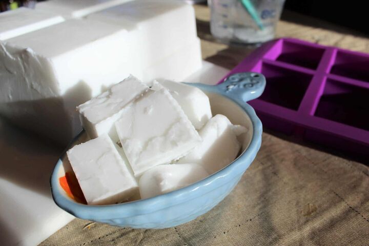 blocks of plain goat milk soap base in a blue bowl