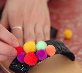 all you need is a bag of pom poms for this colorful diy, Adding pom poms