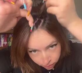 She grabbed a bunch of tiny hairties for this edgy hairstyle that kept her so cool in the hot weather