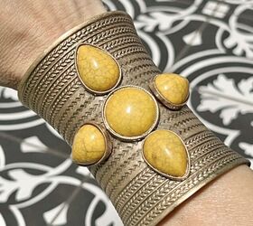 tips on how to wear a cuff bracelet with style, How to Wear a Cuff Bracelet with Style A gold cuff bracelet filled with yellow stones
