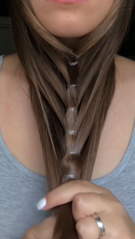 flip your hair for this unique look, Adding hair elastics