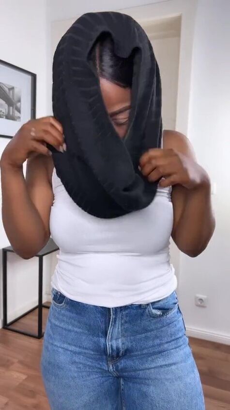 this easy fashion hack upgrades any basic tank, Placing t shirt over head