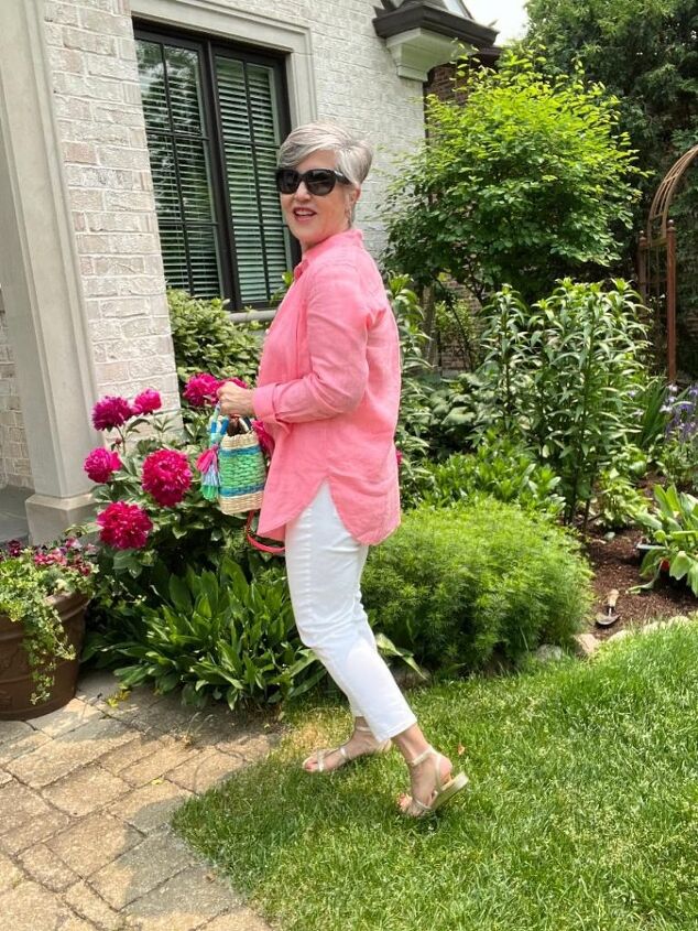 how to wear a linen shirt this summer 4 ways, Here is a side view of how to wear a linen shirt It s paired with a cute striped mini wicker bag white jeans and a white tank