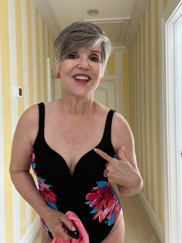 how to wear a linen shirt this summer 4 ways, Here I a pointing at my neckline on the bathing suit which is sculpted with the wire usually used as an underwire in a bra