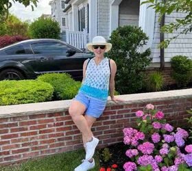casual mom outfits, Here I a wearing a sleeveless foulard cotton tank in blue tones with blue linen shorts and white sneakers My hat is broad brimmed and my sunglasses are ovrtsized