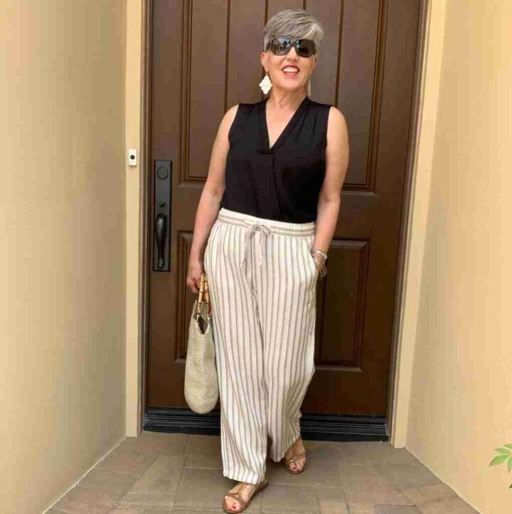 casual mom outfits, In this ninth of the casual mom outfits for women over 50 I am sporting a black v neck tank with tan striped linen pants My bag and shoe are tan as well