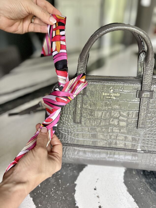 how to tie and style a scarf on your handbag or purse, Tying a knot with a scarf