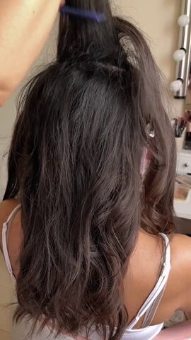 beautiful bun hairstyle for a bride, Applying hairspray