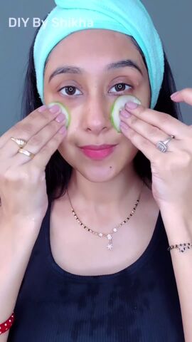 2 ingredients for this easy skin brightening facial, Rubbing cucumbers onto skin
