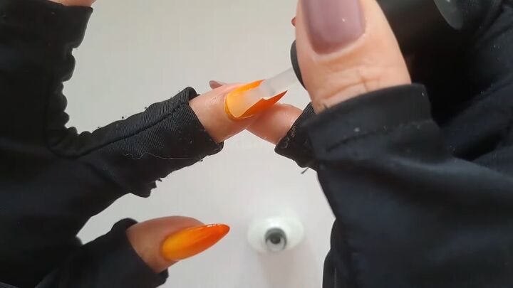 ombre orange nails, Applying top coat