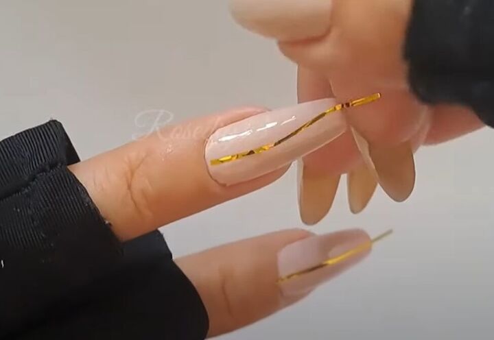easy fall nail art ideas, Applying stripping tape