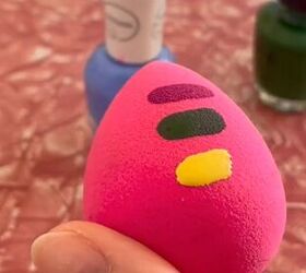 She puts 3 strips of nail polish on a beauty blender for this unforgettably beautiful hack