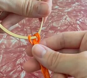 grab some walmart hoops and yarn, Looping yarn around earring