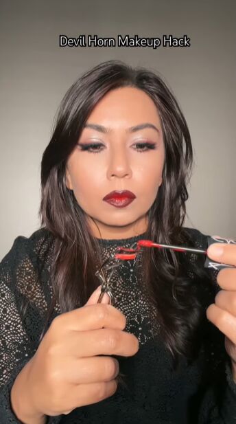 devil horns makeup, Adding lipstick to eyelash curlers