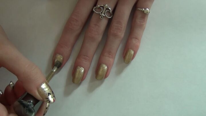 cat nail design, Applying shimmery gold polish