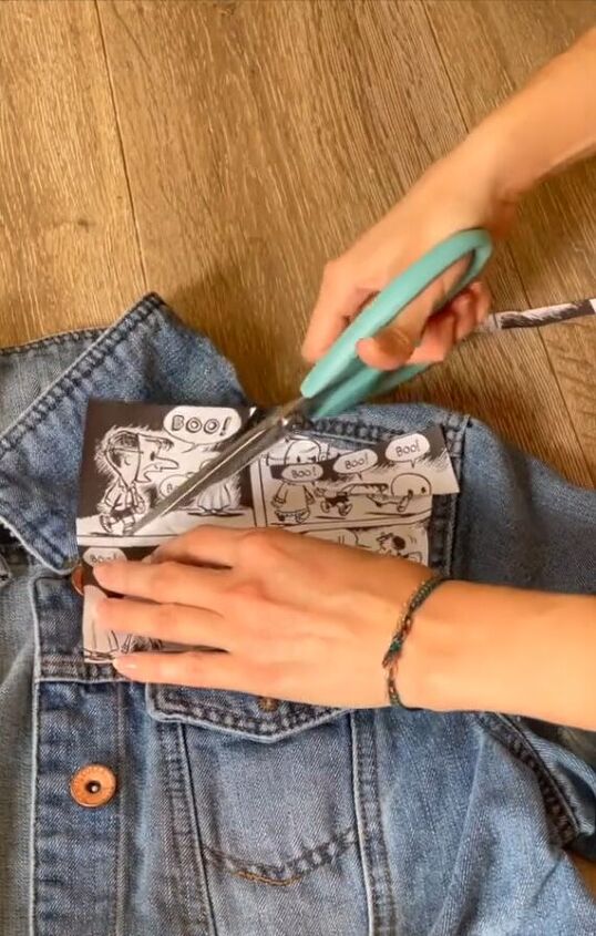 wow this is a stunning way to upcycle a denim jacket with comics, Trimming excess