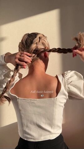 wow check out this amazing braided bun hairdo hack, Pulling braids through eachother