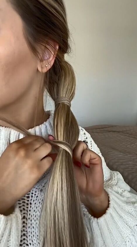sleek ponytail tutorial that covers all rubber bands, Wrapping hair