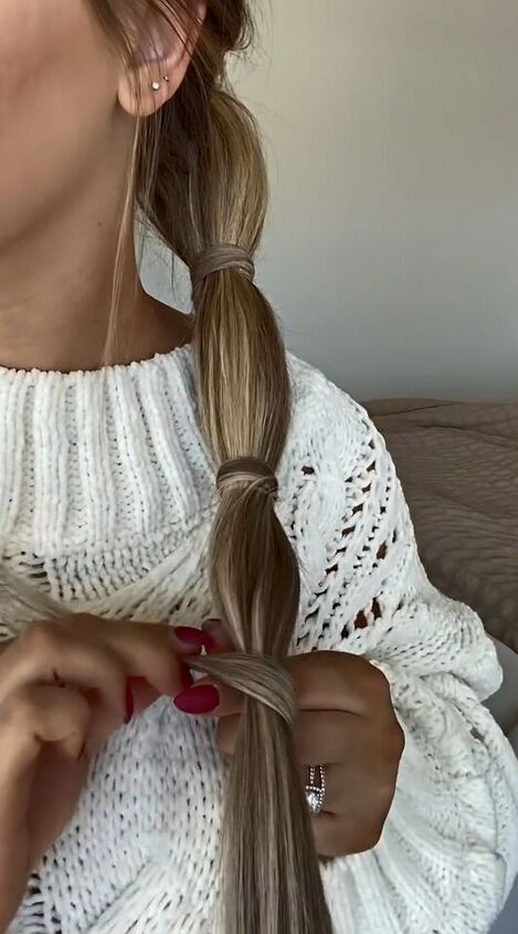 sleek ponytail tutorial that covers all rubber bands, Wrapping hair